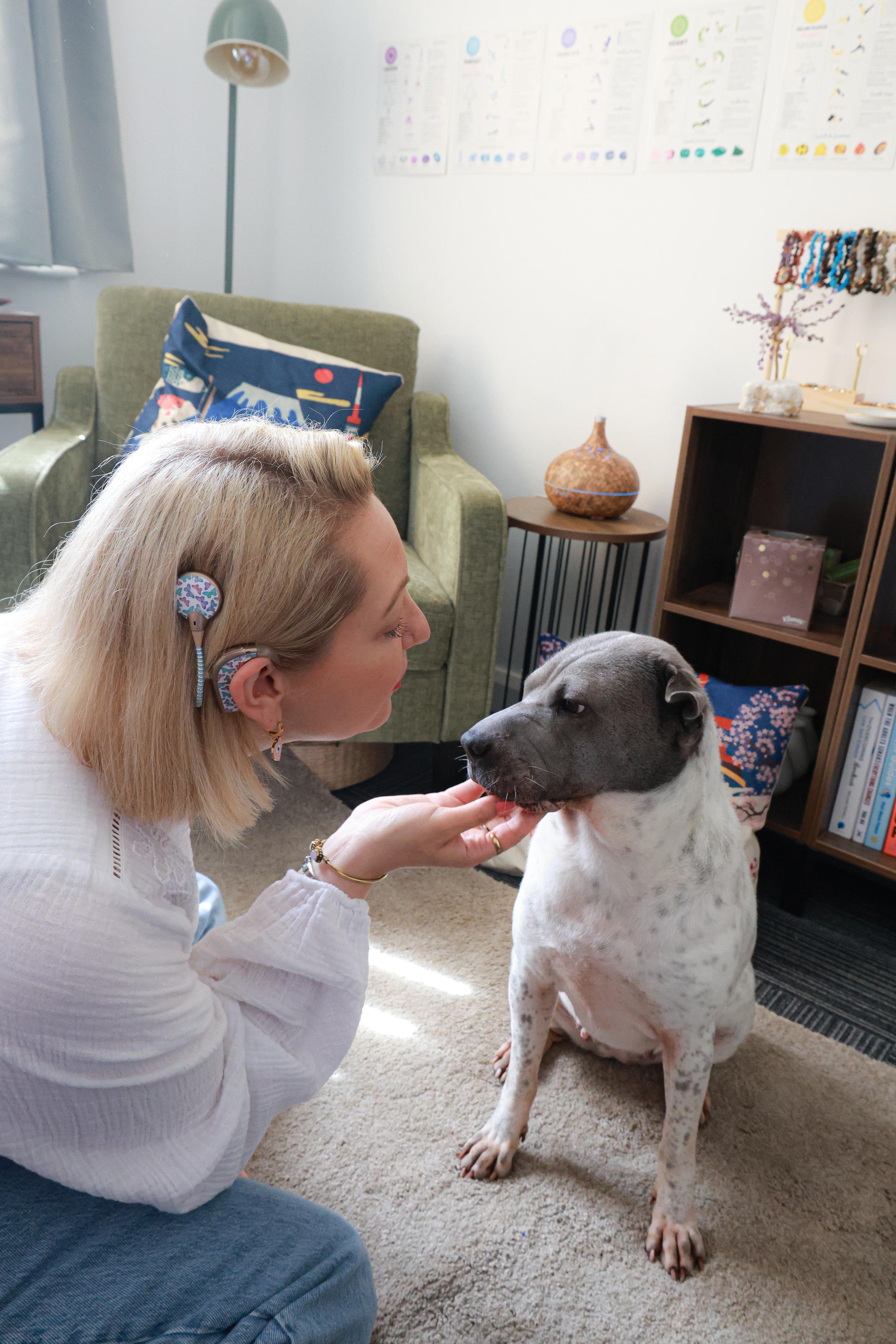 Kerry Tidman with Duckie the therapy dog in the therapy room